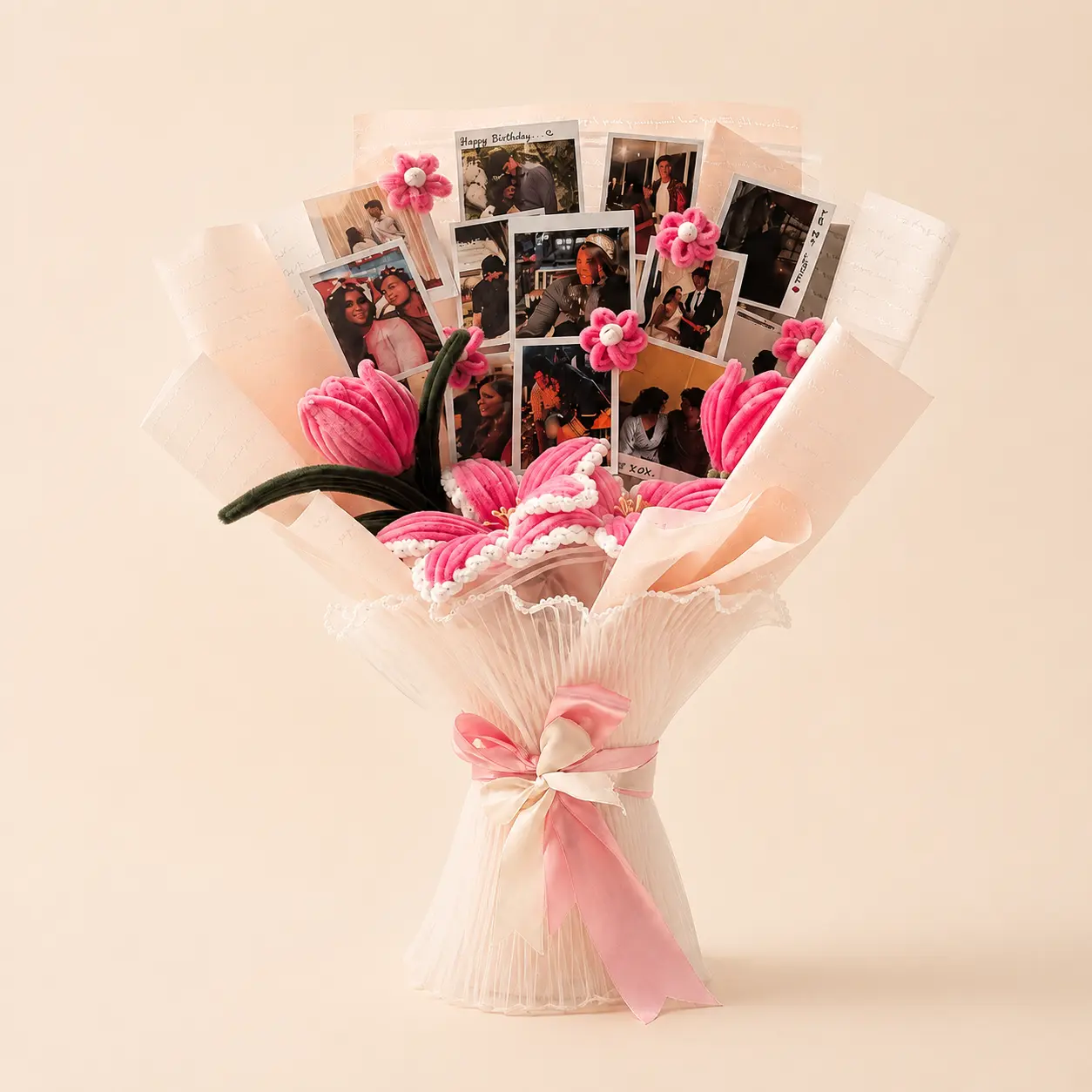 Pink handmade floral bouquet arranged with personal photographs